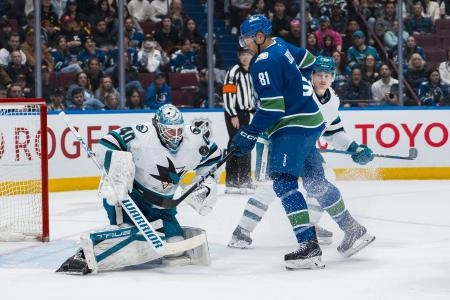 Apr 14, 2025; Vancouver, British Columbia, CAN; San Jose Sharks defenseman Jimmy Schuldt (59) watches as Vancouver Canucks forward Dakota Joshua (81) battles for the rebound with goalie Alexandar Georgiev (40) in the second period at Rogers Arena. Apr 14, 2025; Vancouver, British Columbia, CAN; San Jose Sharks defenseman Jimmy Schuldt (59) watches as Vancouver Canucks forward Dakota Joshua (81) battles for the rebound with goalie Alexandar Georgiev (40) in the second period at Rogers Arena.
