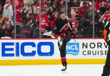 May 10, 2025; Raleigh, North Carolina, USA; Carolina Hurricanes center Jack Roslovic (96) celebrates his goal against the Washington Capitals during the second period in game three of the second round of the 2025 Stanley Cup Playoffs at Lenovo Center. Mandatory Credit: James Guillory-Imagn Images