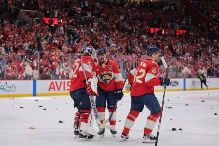 Jun 9, 2025; Sunrise, Florida, USA; Florida Panthers forward Evan Rodrigues (17) celebrates with goaltender Sergei Bobrovsky (72) after the third period in game three of the 2025 Stanley Cup Final at Amerant Bank Arena. Mandatory Credit: Sam Navarro-Imagn Images