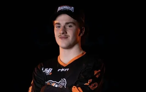 Christophe Babin seen smiling for a photo in a hockey jersey