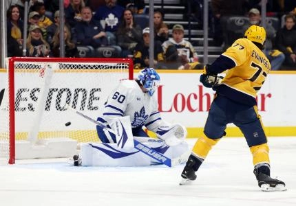 Nashville Predators forward Luke Evangelista scoring a goal past Toronto Maple Leafs goaltender Joseph Woll. Nashville Predators forward Luke Evangelista scoring a goal past Toronto Maple Leafs goaltender Joseph Woll.