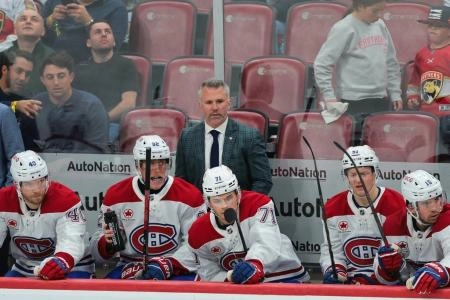 Dec 28, 2024; Sunrise, Florida, USA; Montreal Canadiens head coach Martin St-Louis watches from the bench against the Florida Panthers during the third period at Amerant Bank Arena. Mandatory Credit: Sam Navarro-Imagn Images