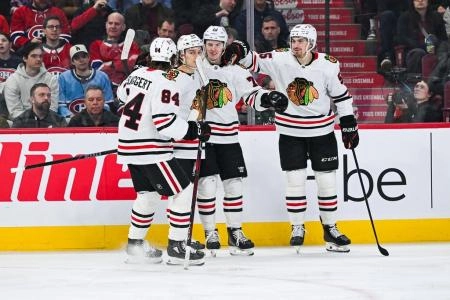 Apr 14, 2025; Montreal, Quebec, CAN; Chicago Blackhawks left wing Lukas Reichel (73) celebrates with his teammates after scoring against the Montreal Canadiens in the third period at Bell Centre. Mandatory Credit: David Kirouac-Imagn Images