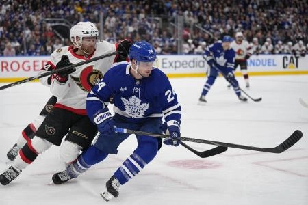 Toronto Maple Leafs forward Scott Laughton getting away from the checking of Ottawa Senators defenseman Nick Jensen. Toronto Maple Leafs forward Scott Laughton getting away from the checking of Ottawa Senators defenseman Nick Jensen.