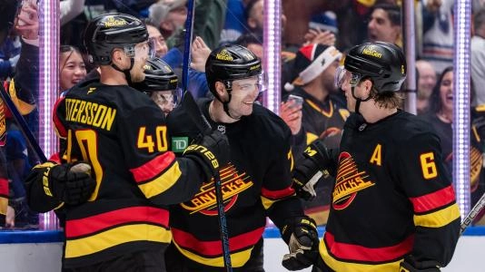 Vancouver Canucks forwards Elias Pettersson, Jake DeBrusk  Brock Boeser.