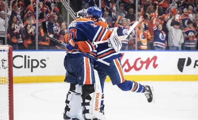Edmonton Oilers goalie Calvin Pickard (30) and Connor Brown (28) celebrate the win over the Los Angeles Kings during NHL playoff action in Edmonton on Thursday, May 1, 2025. (Jason Franson/The Canadian Press via AP)