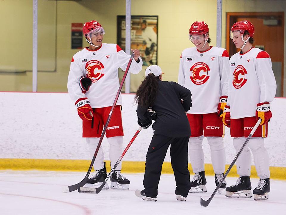  Calgary Flames power skating coach Danielle Fujita works with from left; Zayne Parekh, Etienne Morin and Henry Mews during the Calgary Flames annual development camp at WinSport on Wednesday, July 2, 2025.