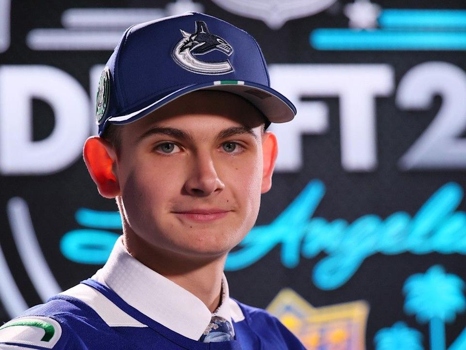  Alexei Medvedev poses after being drafted by the Vancouver Canucks with the 47th overall pick during rounds 2-7 of the 2025 Upper Deck NHL Draft at Peacock Theater on June 28, 2025 in Los Angeles.