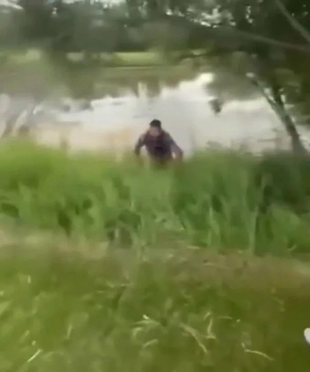 Trevor Ogilvie crawls out of a pond after being dumped in by Nick Tarnasky on July 4, 2025. X/NUCLR Golf