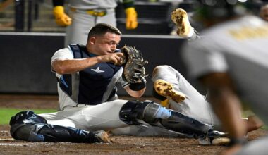 Tampa Bay Rays catcher Matt Thaiss tags out Athletics' Max Schuemann at home plate during the tenth inning of a baseball game Tuesday, July 1, 2025, in Tampa, Fla. (AP Photo/Jason Behnken)