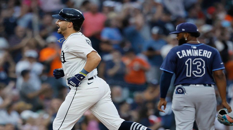 Detroit Tigers' Zach McKinstry, left, rounds the bases past Tampa Bay Rays third baseman Junior Caminero (13) after hitting a home run during the seventh inning of a baseball game Monday, July 7, 2025, in Detroit. (AP Photo/Duane Burleson)