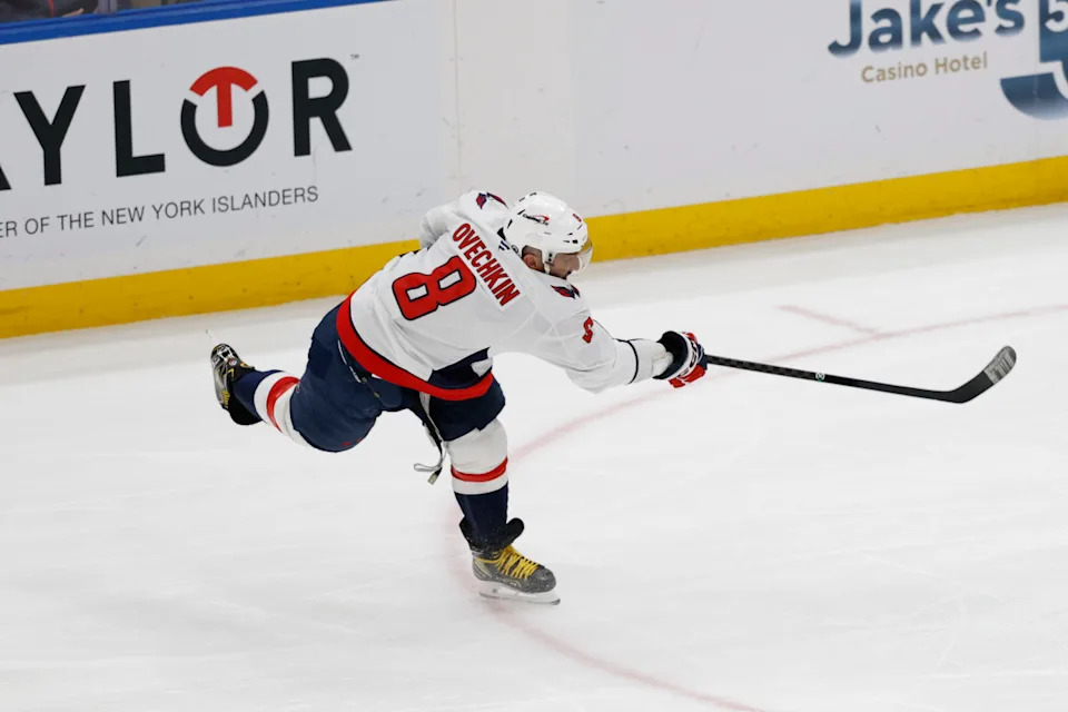 Washington Capitals left wing Alex Ovechkin (8) scores the record-breaking goal against the New York Islanders.Geoff Burke-Imagn Images