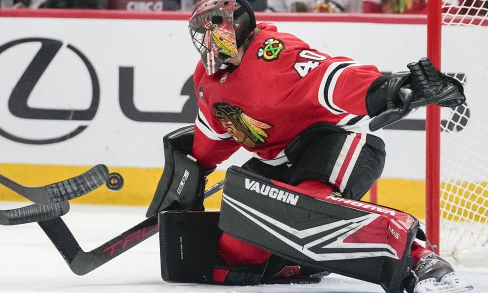 Chicago Blackhawks goaltender Arvid Soderblom deflects a shot during the first period an NHL hockey game against the Nashville Predators, Tuesday, Dec. 5, 2023, in Chicago. (AP Photo/Erin Hooley)