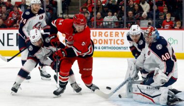 San Jose Sharks center Nico Sturm (7) and Columbus Blue Jackets left wing Dmitri Voronkov (10) reach for the puck in front of goaltender Alexandar Georgiev (40) in the first period of an NHL hockey game Thursday, Jan. 16, 2025, in Columbus, Ohio. (AP Photo/Sue Ogrocki)