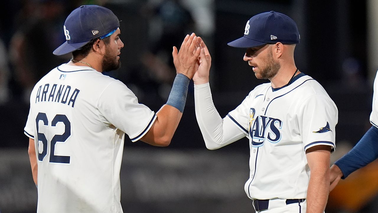 Tampa Bay Rays' Jonathan Aranda (62) celebrates with second base Brandon Lowe after a baseball game against the Texas Rangers Wednesday, June 4, 2025, in Tampa, Fla. (AP Photo/Chris O'Meara)