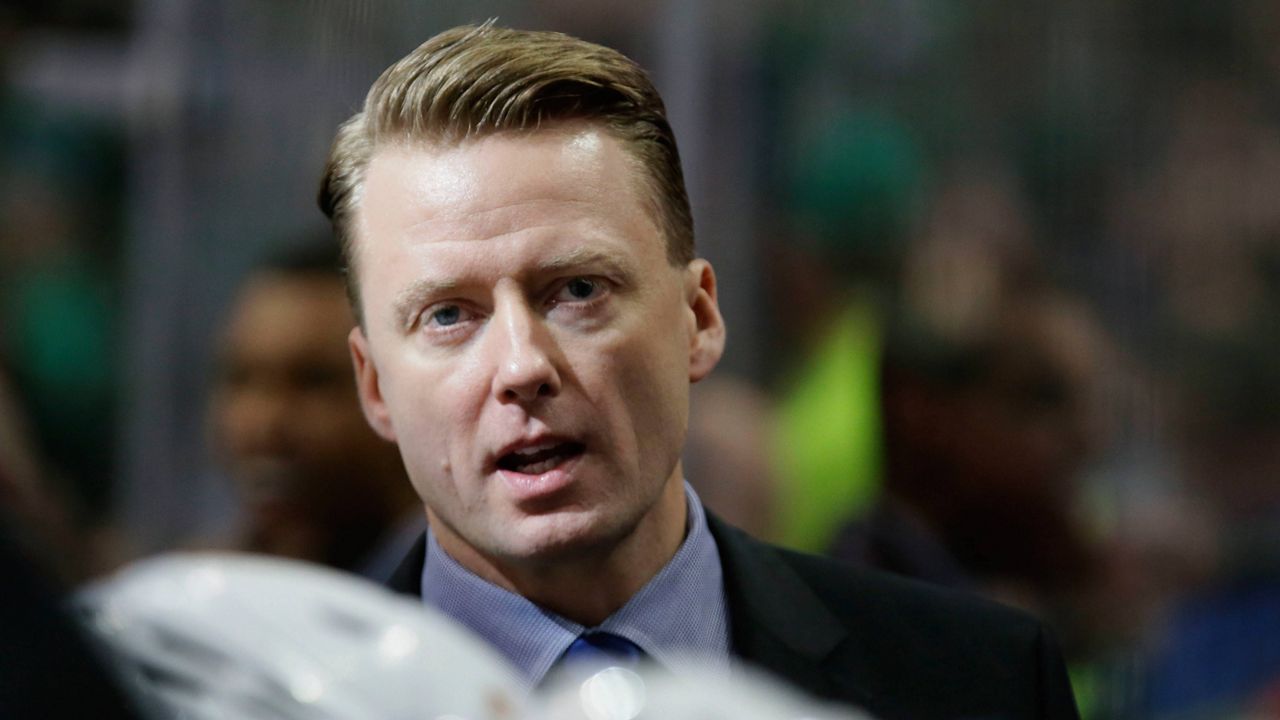 Glen Gulutzan talks on the while standing on the bench during the first period of an NHL hockey game in Dallas, Tuesday, Dec. 6, 2016. (AP Photo/LM Otero)