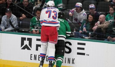 New York Rangers center Matt Rempe (73), who was ejected for game misconduct, slams Dallas Stars' Miro Heiskanen (4) against the boards in the third period of an NHL hockey game in Dallas, Friday, Dec. 20, 2024. (AP Photo/Tony Gutierrez)