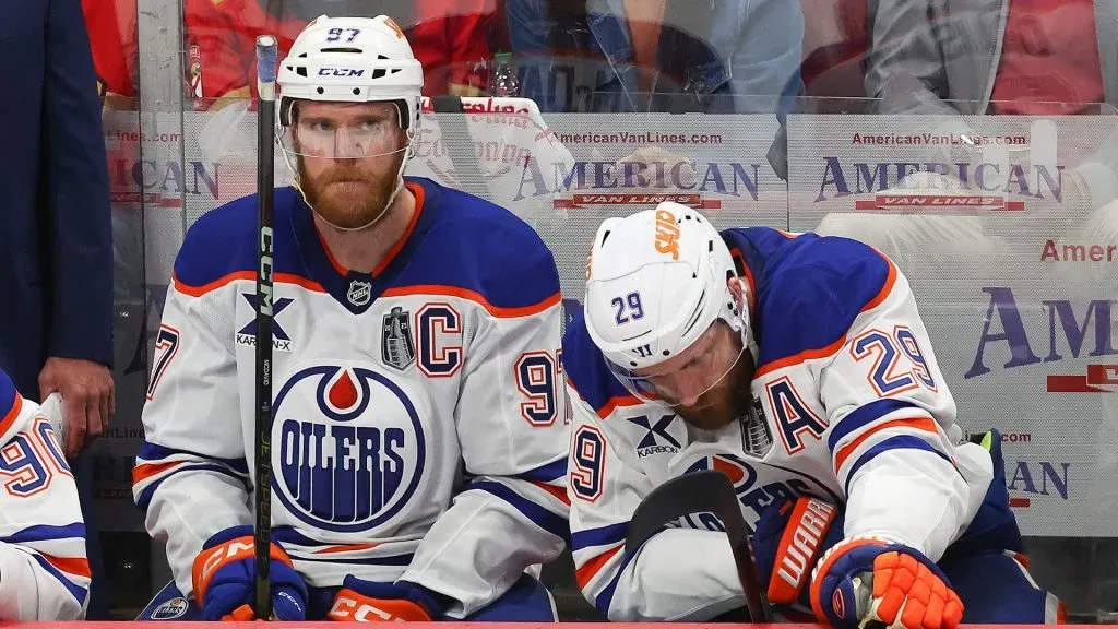 Connor McDavid #97 and Leon Draisaitl #29 of the Edmonton Oilers react after a goal by the Florida Panthers during the second period in Game Six of the 2025 Stanley Cup Final. (Photo by Mike Carlson/Getty Images)