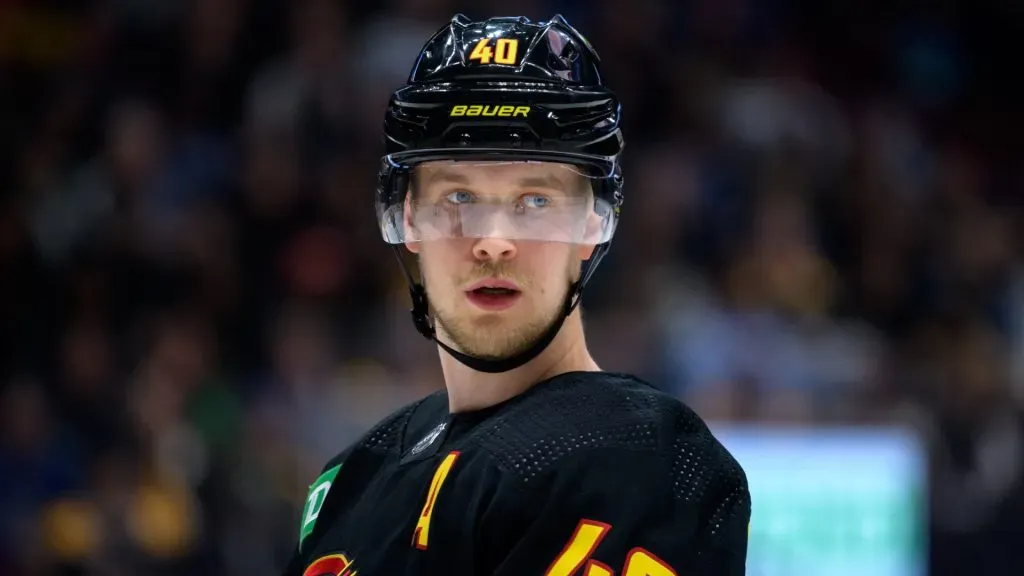 Elias Pettersson #40 of the Vancouver Canucks waits for a face-off during the first period of their NHL game against the Boston Bruins at Rogers Arena on February 25, 2023 in Vancouver, British Columbia, Canada.
