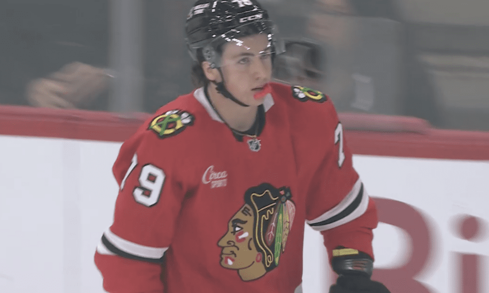 AJ Spellacy skates to the bench during the Chicago Blackhawks preseason opener against the Detroit Red Wings mid way through the first period.