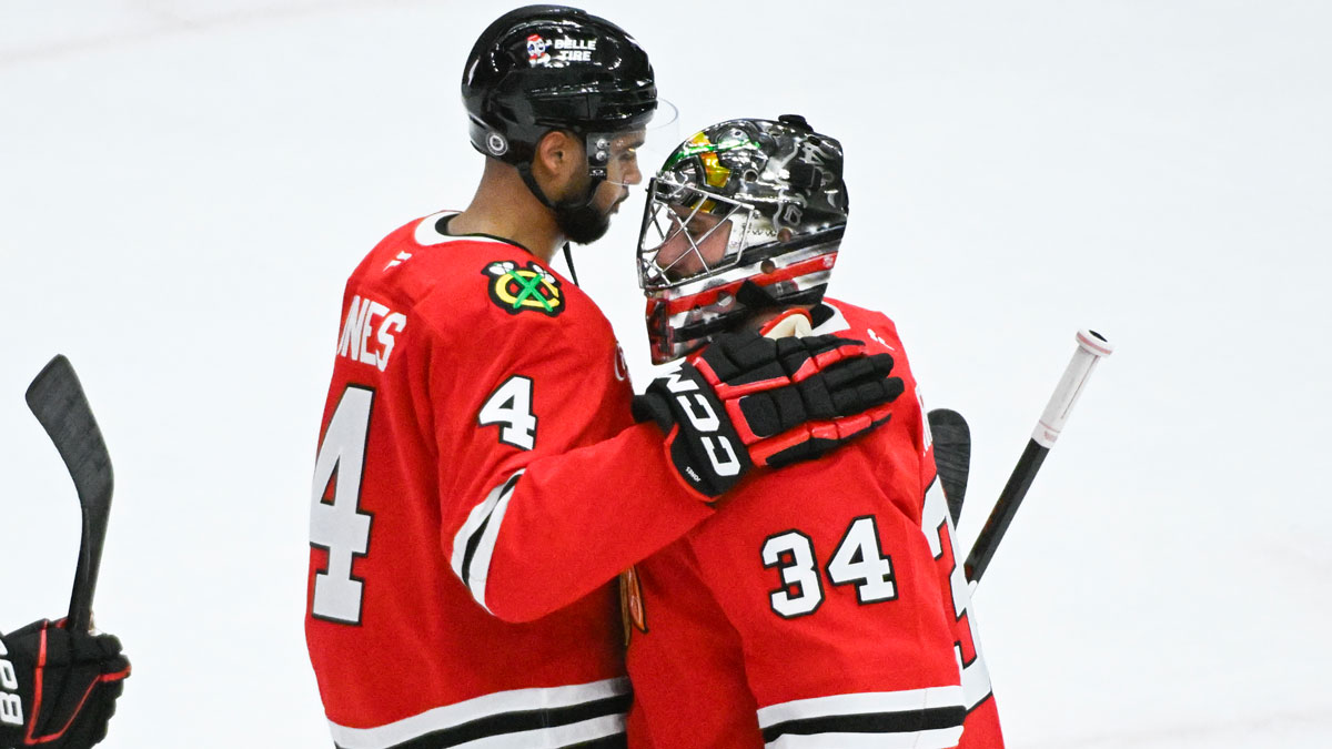 Chicago Blackhawks goaltender Petr Mrazek (34) hugs defenseman Seth Jones (4) after the game against the Vegas Golden Knights at United Center.