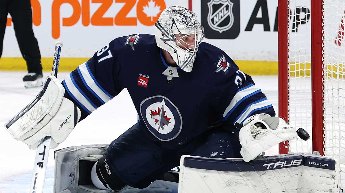 Winnipeg Jets goaltender Connor Hellebuyck (37) watches the puck cross the goal line in the first period against the Anaheim Ducks at Canada Life Centre.