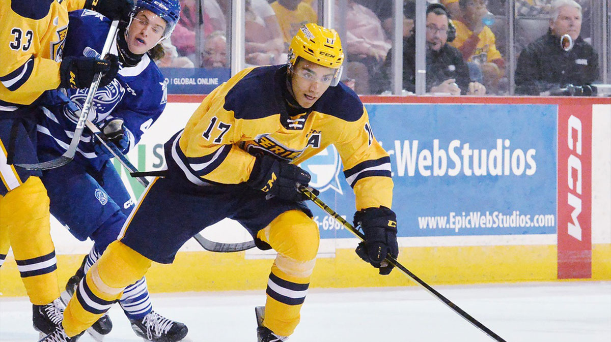 Erie Otters LW Malcolm Spence, center, competes against the Mississauga Steelheads at Erie Insurance Arena in Erie on Sept. 30, 2023.
