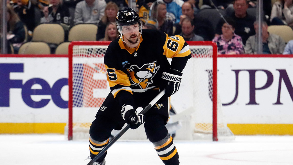 Pittsburgh Penguins defenseman Erik Karlsson (65) skates with the puck against the Nashville Predators during the first period at PPG Paints Arena.