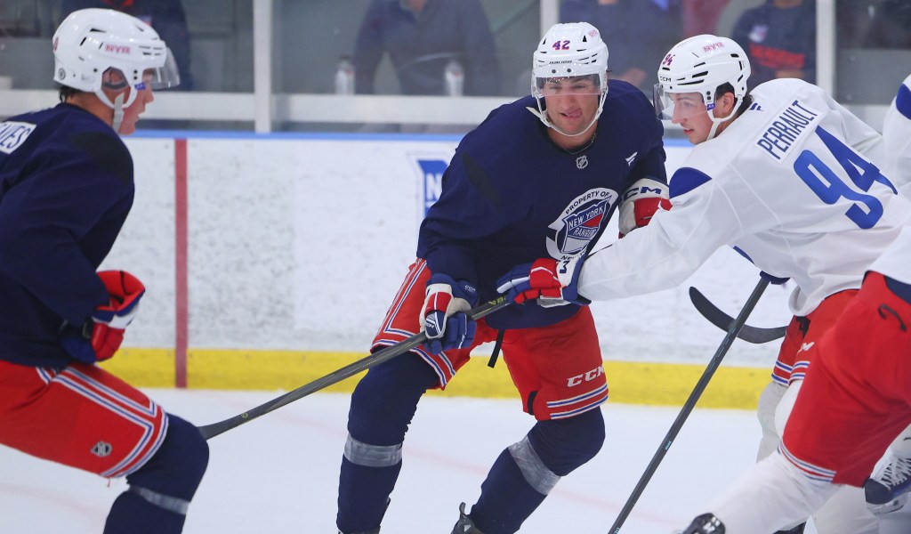  Gabe Perrault (94, right) battles Noah Laba during the Rangers rookie training camp on July 2, 2025.