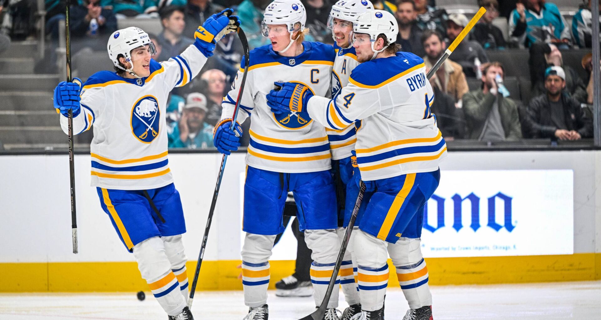 Bowen Byram and the Buffalo Sabres celebrate a goal against the San Jose Sharks.