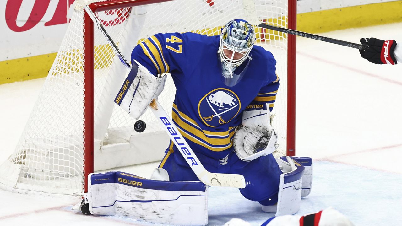 Buffalo Sabres goaltender James Reimer (47) makes a save during the third period of an NHL hockey game against the Ottawa Senators, Tuesday, March 25, 2025, in Buffalo, N.Y. (AP Photo/Jeffrey T. Barnes)