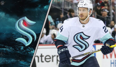 Seattle Kraken defenseman Jamie Oleksiak skates during an NHL game, with intense NHL trade rumors swirling about his future with the team.