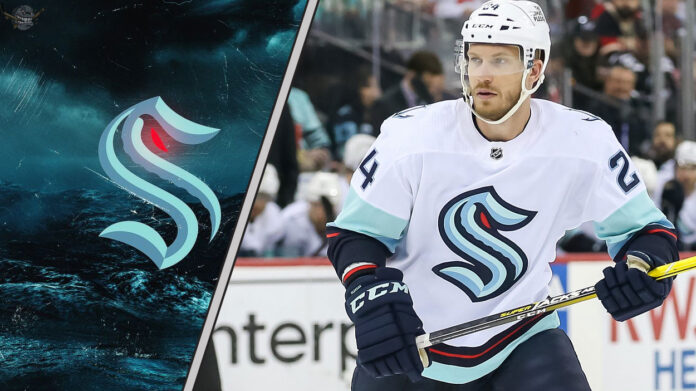 Seattle Kraken defenseman Jamie Oleksiak skates during an NHL game, with intense NHL trade rumors swirling about his future with the team.