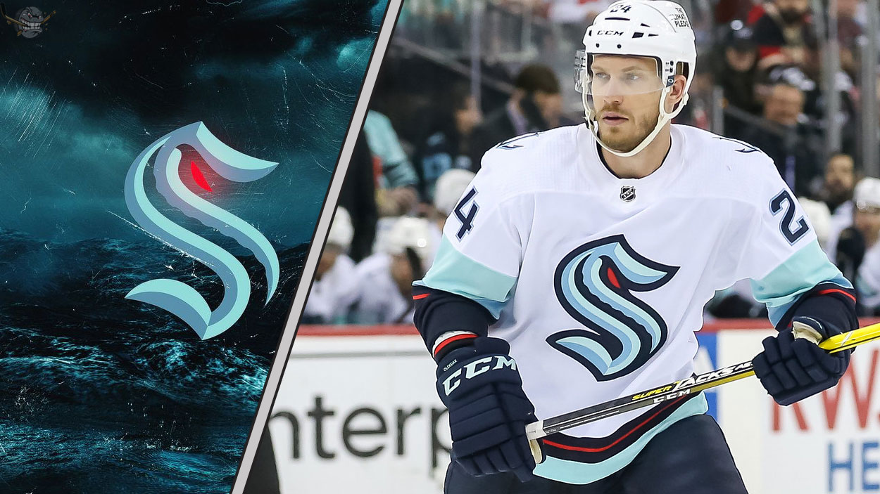 Seattle Kraken defenseman Jamie Oleksiak skates during an NHL game, with intense NHL trade rumors swirling about his future with the team.
