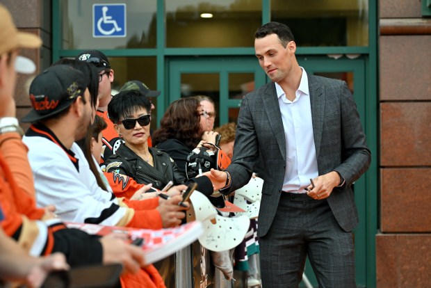 Ducks defenseman Brian Dumoulin greets fans during the Orange Carpet...