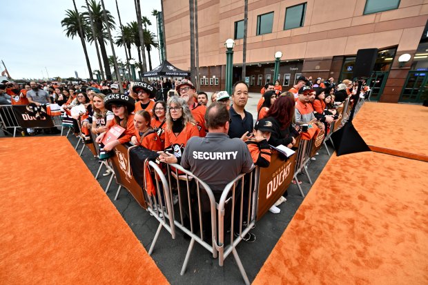 Fans wait for Ducks players during the Orange Carpet fan...