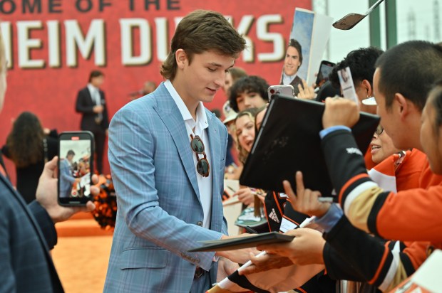 Ducks forward Trevor Zegras signs autographs during the Orange Carpet...