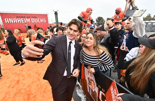 Ducks rookie Cutter Gauthier takes a selfie with Emily Janes...