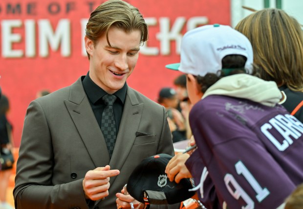 Ducks goaltender Lukas Dostal signs autographs during the Orange Carpet...