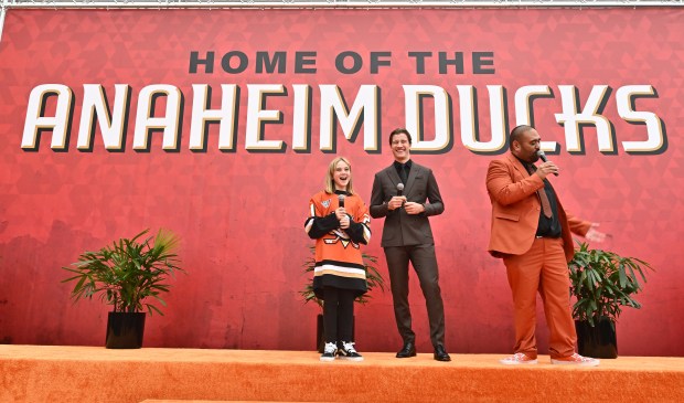 DJ Joao, right, introduces this year’s 21st Duck, 9-year-old Emma...