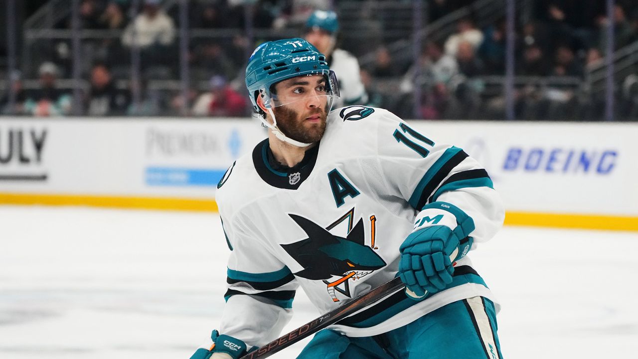 San Jose Sharks center Luke Kunin (11) in action against the Seattle Kraken during an NHL hockey game Thursday, Jan. 30, 2025, in Seattle.