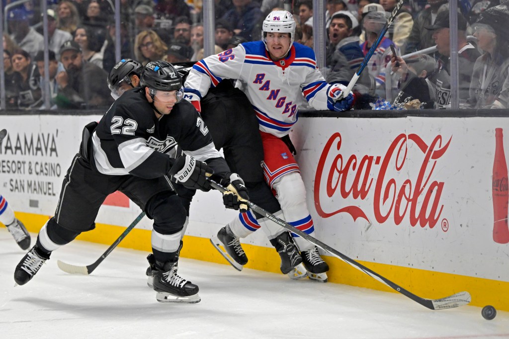 Nicolas Aube-Kubel is checked by Kevin Fiala during the Rangers' 3-1 loss to Kings on March 25, 2025.