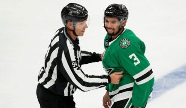 Linesman Bryan Pancich (94) holds Dallas Stars' Matt Dumba (3) back after a brief scuffle with Minnesota Wild players in the second period of a preseason NHL hockey game, Sept. 25, 2024, in Dallas. (AP Photo/Tony Gutierrez, File)