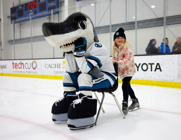 Ella Pallari, 7, from Livermore, tries to push San Jose Sharks mascot SJ Sharkie during the LKT1D Fund (Luke Kunin Type 1 Diabetes) Skating Party at Sharks Ice in San Jose, Calif., on Sunday, Jan. 26, 2025. (Nhat V. Meyer/Bay Area News Group)