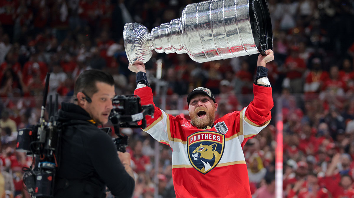 Florida Panthers center Sam Bennett (9) hoists the Stanley Cup after winning game six of the 2025 Stanley Cup Final against the Edmonton Oilers at Amerant Bank Arena.