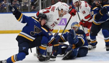 Carolina Hurricanes' Jesper Fast (71) attempts a shot on goal against St. Louis Blues' Torey Krug (47) and Jordan Binnington (50) on Thursday, Dec. 1, 2022, in St. Louis. (AP File Photo/Michael Thomas)