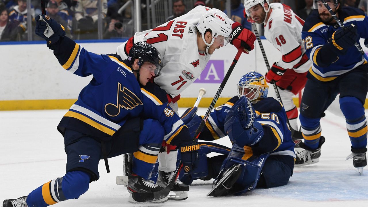 Carolina Hurricanes' Jesper Fast (71) attempts a shot on goal against St. Louis Blues' Torey Krug (47) and Jordan Binnington (50) on Thursday, Dec. 1, 2022, in St. Louis. (AP File Photo/Michael Thomas)