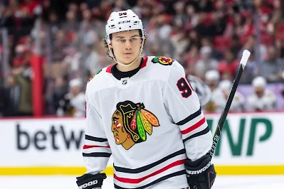 Chicago Blackhawks forward Connor Bedard reacts during 2025 game.