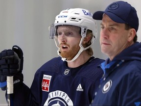 Jets forward Kyle Connor and coach Scott Arniel at practice