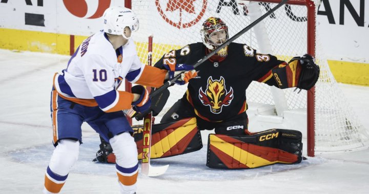 Wolf solid in net as Flames hang on for 2-1 shootout win over Islanders